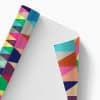 Colorful printed wrapping paper with a geometric triangle pattern, designed for custom gift wrapping at The Wraperie. Perfect for adding vibrant flair to any gift wrap or package presentation.