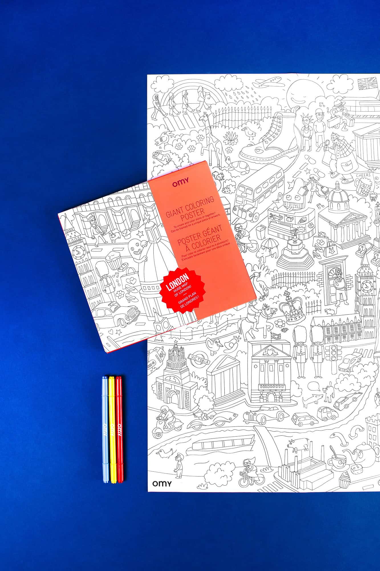Coloring poster of London's iconic landmarks and attractions on a vibrant blue background with colored pens.