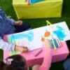 Colorful children’s chalk art on outdoor table at The Wraperie, showcasing fun, creative activity space, perfect for kids’ parties and events. Enjoy vibrant, playful designs made with washable chalk.