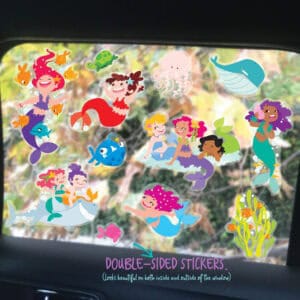 Colorful mermaid and ocean-themed double-sided stickers applied to car window, perfect for kids' rooms or vehicles, showcasing vibrant underwater characters and marine life.