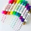Brightly colored stamp markers with fun, eye-catching designs on the labels, ideal for arts and crafts, scrapbooking, or creative projects.