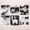 Funny black and white dinosaur illustrations, playful cartoon style artwork, creative dinosaur designs, bold outlines, whimsical sci-fi themed scenes, perfect for kids and dinosaur enthusiasts, displayed on a wall at The Wraperie.