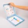 Paint set for kids with colorful paints, brushes, and illustrated coloring pages in a light blue box for creative fun at The Wraperie.