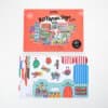Colorful DIY 3D paper toy city building kit with various urban elements for children.