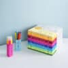 Vibrant color pens and a stack of coloring posters from The Wraperie, perfect for kids' arts and crafts, creative projects, and entertainment. Bright, fun, and educational coloring supplies.
