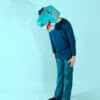 Vibrant blue dragon-themed paper mask on child for creative dress-up, playful costume, and whimsical event costume ideas, perfect for kids’ parties and fun activities.