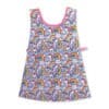 Colorful unicorn print on children's pink and blue sleeveless apron, perfect for kids' craft or cooking activities at The Wraperie.