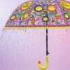 Colorful children's umbrella with cheerful bee and flower illustrations, perfect for rainy days and outdoor adventures. Bright pink background with water droplets for a fun, vibrant look.