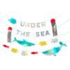 Colorful under the sea themed party banner with fish, sharks, and ocean motifs, perfect for children's birthday parties and ocean-themed celebrations.