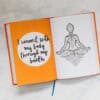 Colorful open journal with motivational quote and meditative illustration, promoting wellness and self-care from The Wraperie.