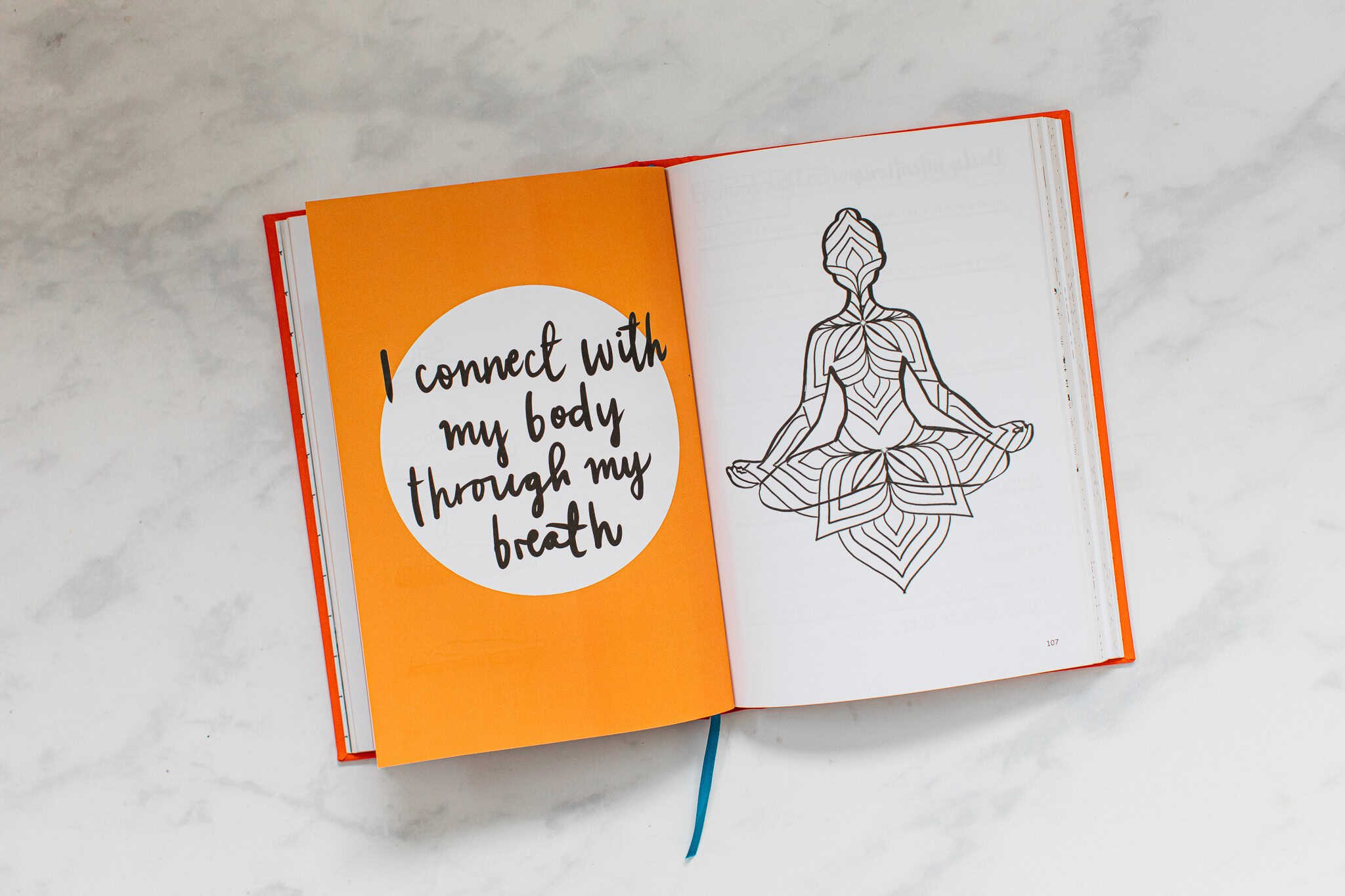 Colorful open journal with motivational quote and meditative illustration, promoting wellness and self-care from The Wraperie.