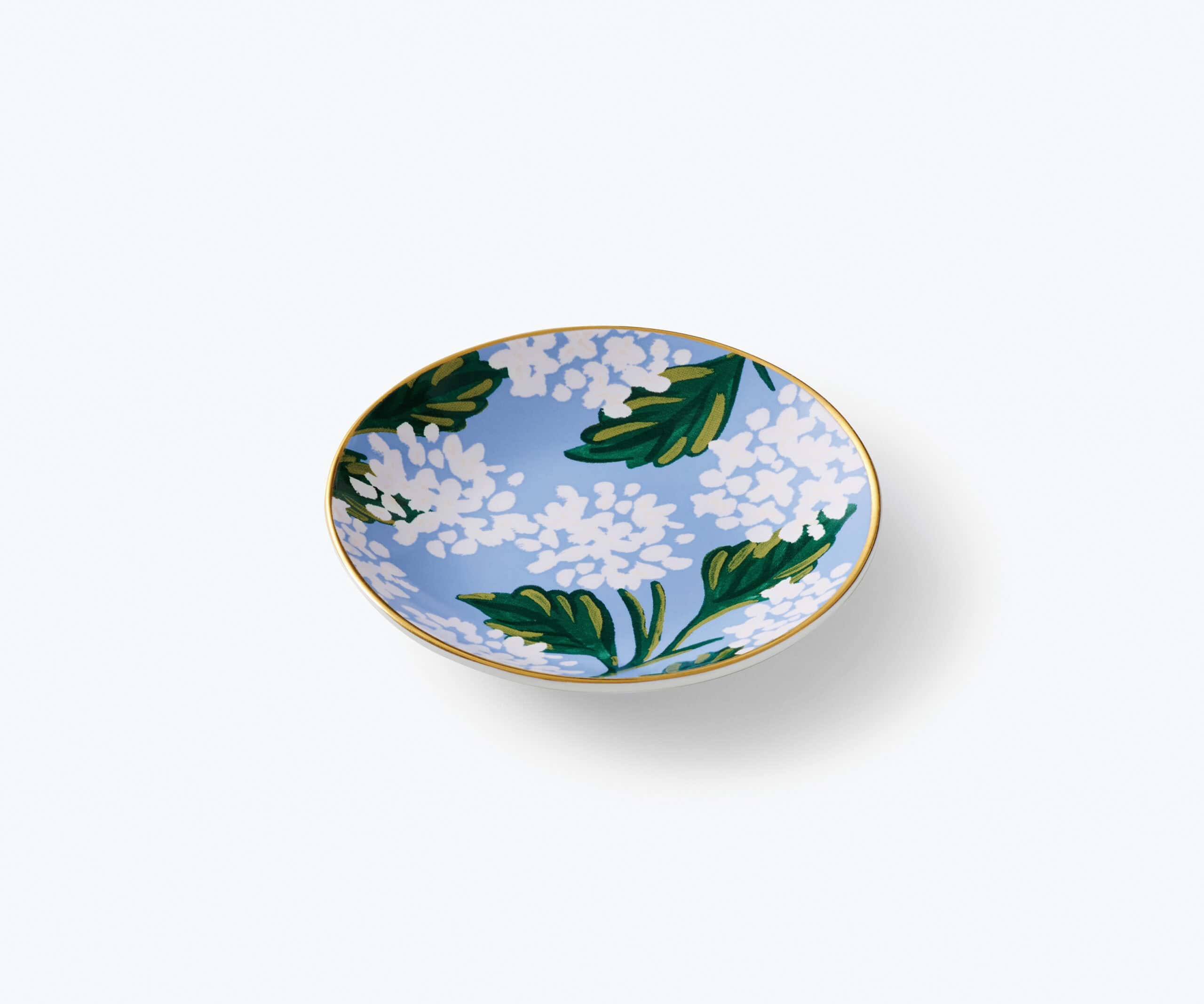 Colorful ceramic bowl with floral and leaf design, perfect for serving or decorative use.