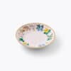 Colorful floral patterned ceramic bowl with gold rim, perfect for serving and decorating, from The Wraperie collection. Ideal for adding a touch of elegance and charm to your table setting.