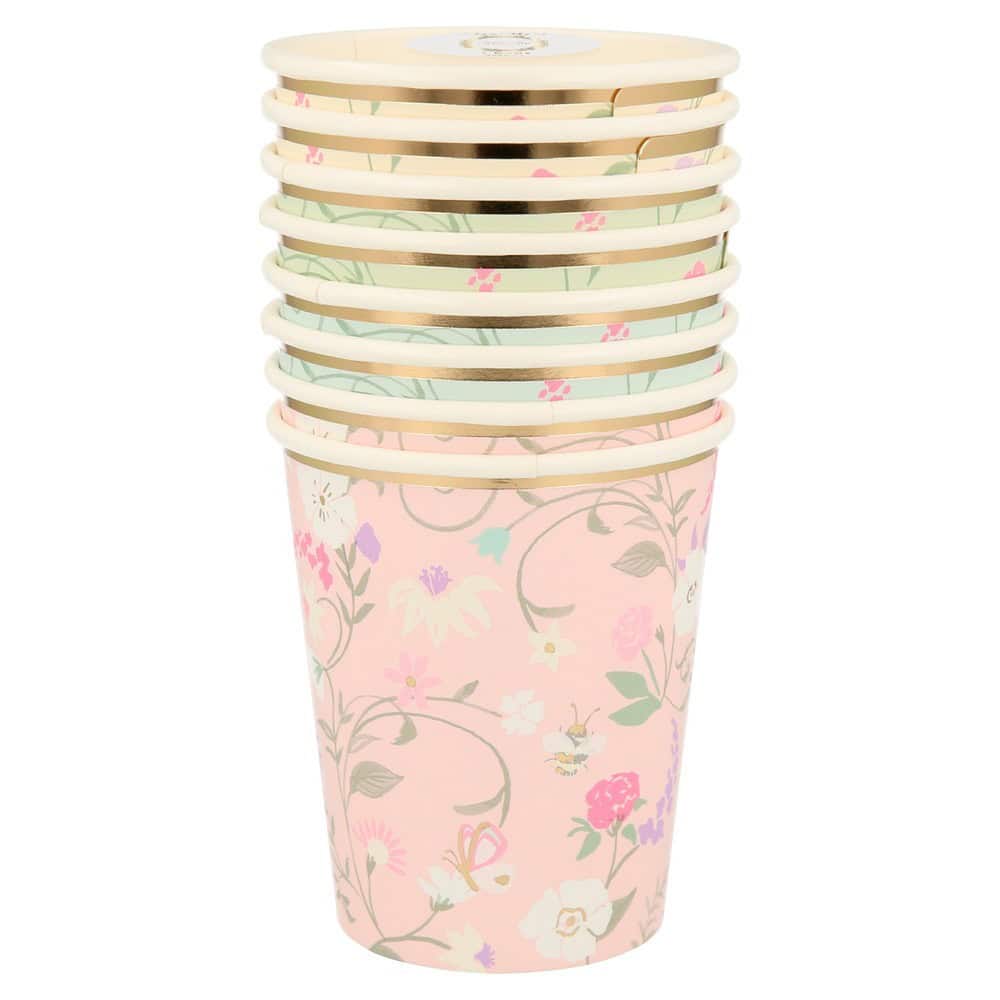 Colorful floral paper coffee cups with gold rims for eco-friendly hot beverage serving. Perfect for cafes, parties, and events, featuring a pink and pastel floral design.