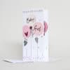 Balloon-themed baby shower congratulations card for welcoming a baby girl, featuring pastel pink and white balloons with floral accents. Ideal for celebrating new arrivals with stylish, cute designs.