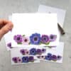 Vibrant floral stationery featuring hand-painted anemone flowers in pink, purple, and blue tones, perfect for personalized greeting cards or elegant invitations.