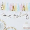 Colorful birthday decorations with pastel tassels and a 