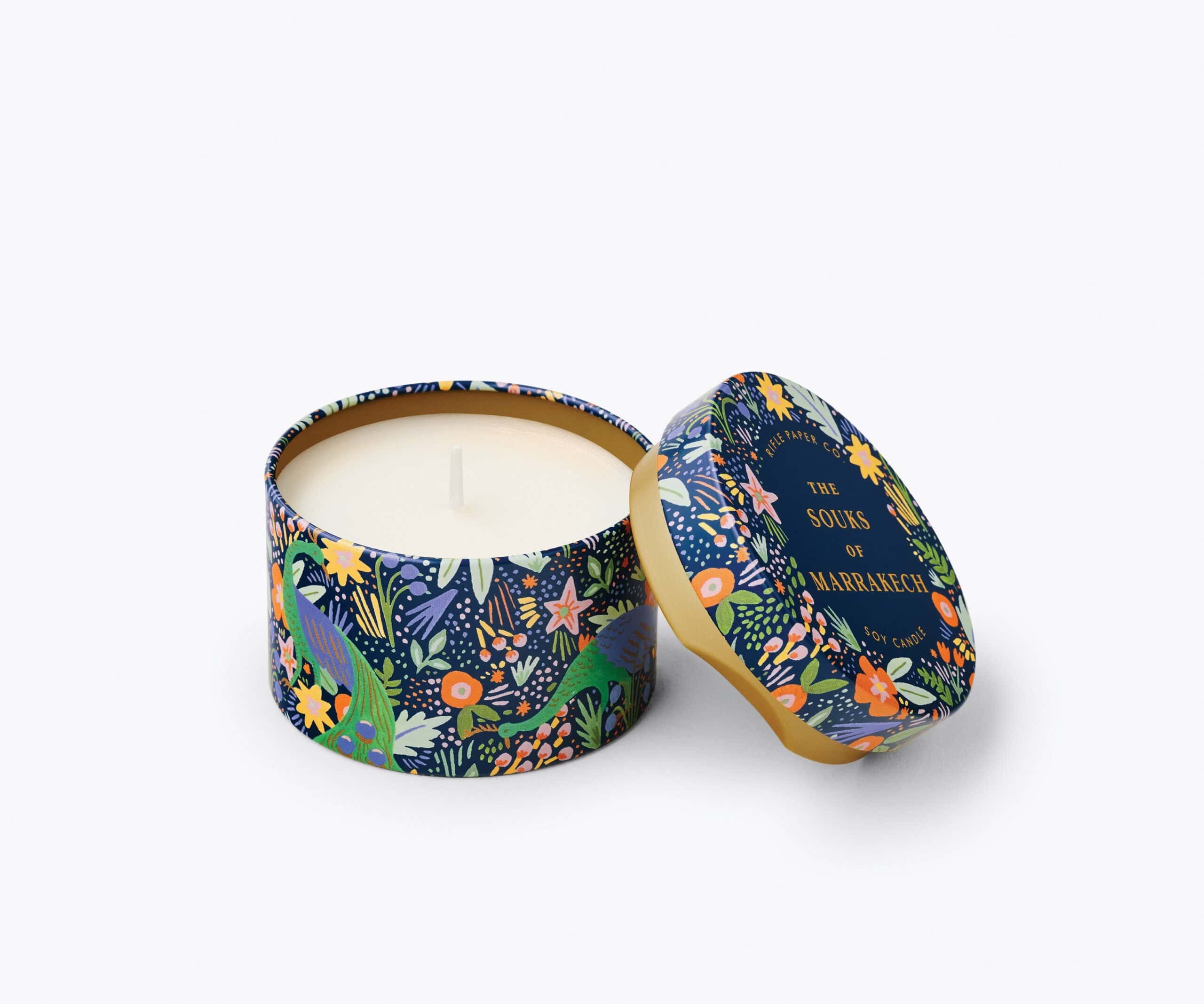 Hand-poured soy candle in a decorative floral and animal print tin, inspired by Marrakech, perfect for home decor and relaxation, available at The Wraperie.