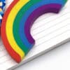 Rainbow foam letter C on notebook with rainbow pen, vibrant colorful stationery, creative office supplies, and decorative stationery for school or work.