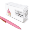Pink pen with gold clip and a clear acrylic pencil holder featuring cupcake and birthday candle designs for personalized little notes.