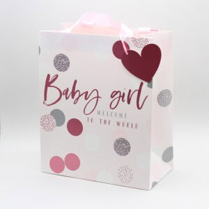 Elegant baby shower gift bag with "Baby girl" message, pink and gray polka dot design, perfect for celebrating a newborn girl. Ideal for gifting at baby showers or welcoming a baby girl.