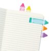 Colorful page flags in a notebook, used for organization and bookmarking, perfect for office, study, or home planning. Bright, decorative sticky tabs for easy marking.