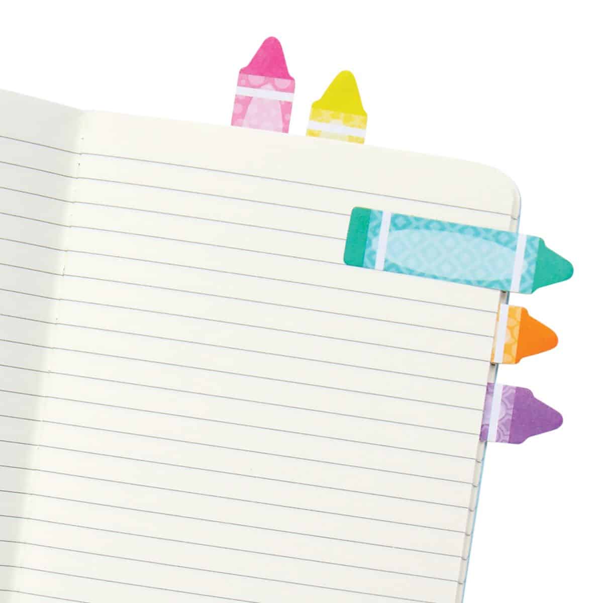 Colorful page flags in a notebook, used for organization and bookmarking, perfect for office, study, or home planning. Bright, decorative sticky tabs for easy marking.