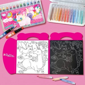 Unicorn and fairy creature coloring book with black and white pages, surrounded by colorful markers, pens, and glitter gel pens on a pink background.