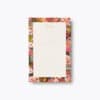Colorful floral notepad with a blank white page for notes, featuring a vibrant, decorative border of pink, red, orange, purple, and green flowers, perfect for stylish note-taking and journaling.