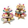 Colorful cupcake display stand with decorated cupcakes, flowers, and heart-shaped toppers, perfect for party or special event desserts, from The Wraperie.