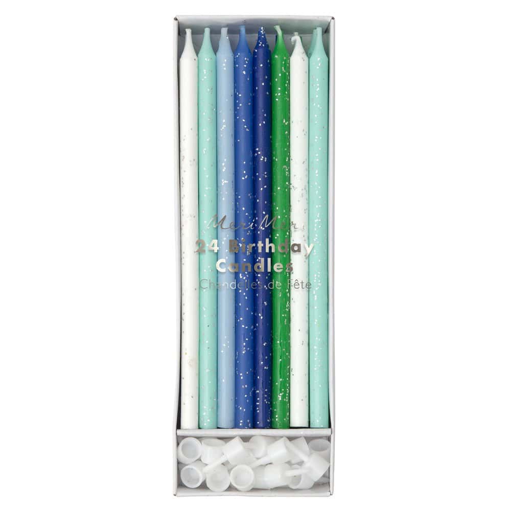 Colorful birthday candles in shades of white, blue, and green with silver glitter accents in a white box, perfect for decorating birthday cakes and special celebrations.