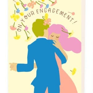 Bright illustration of a couple celebrating their engagement with colorful flowers and the text "On Your Engagement" in a cheerful, romantic style. Perfect for engagement-related events and greetings.