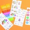 Vibrant sticker sheets with colorful designs including emojis, rainbows, and playful phrases from The Wraperie, perfect for decorating planners, crafts, notebooks, and personalizing your belongings.