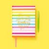 Colorful striped notebook with inspirational quote about teachers on the cover, accompanied by a green gel pen, on a vibrant yellow background, ideal for educational and motivational content.