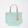 Elegant bee print reusable tote bag with gold handles and tassel, perfect for eco-friendly shopping and daily errands.