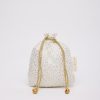 Gold polka dot drawstring gift bag with tassel accents for gift wrapping and packaging - The Wraperie.