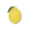 Bright yellow lemon-shaped lip balm container with a green leaf detail, designed for natural beauty care on the go.