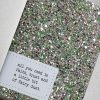 Sparkling glitter with green, silver, and pink sequins on a craft paper background for DIY arts and crafts projects.