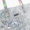 Shimmery tote bag with silver glitter and holographic straps, featuring the 