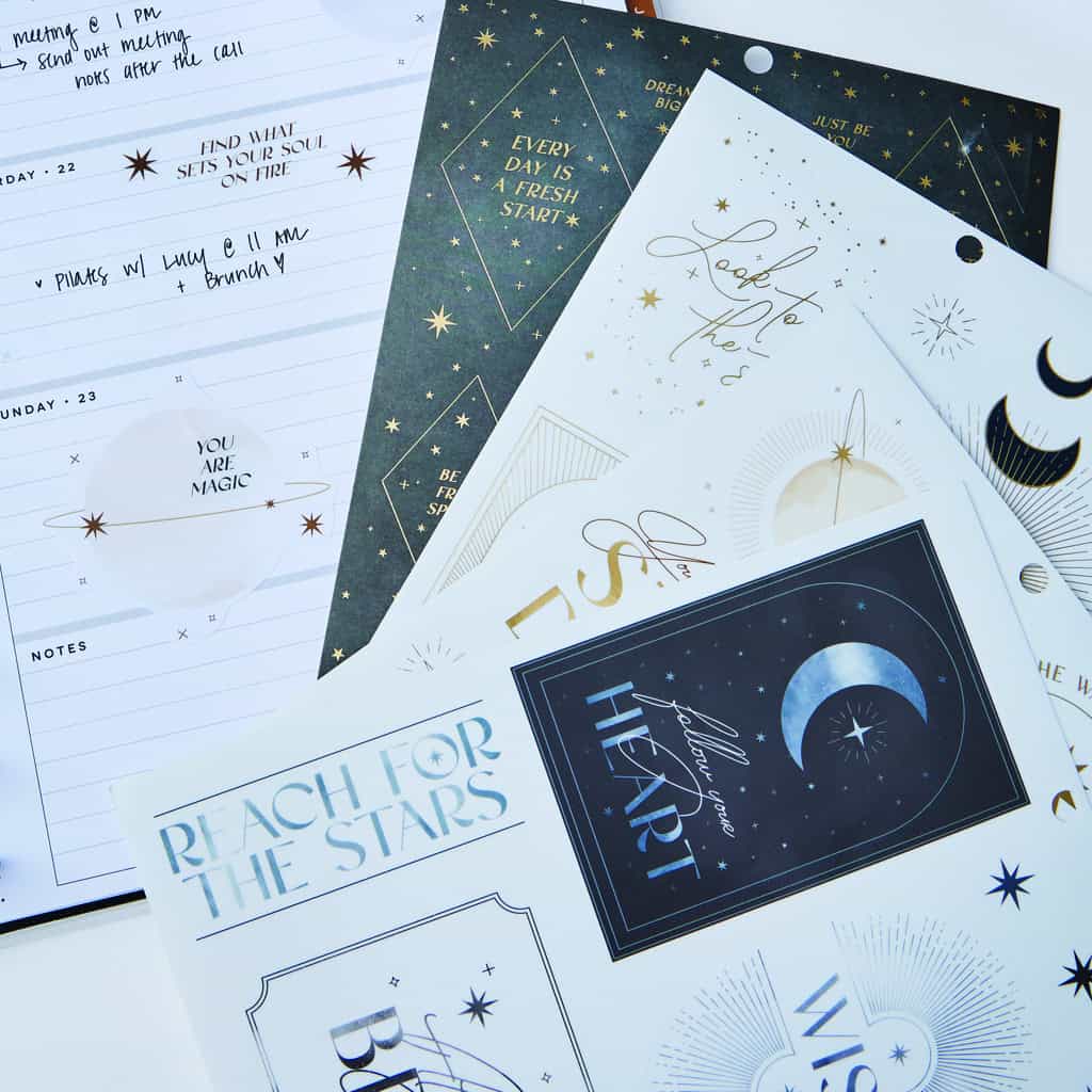 Elegant celestial-themed stationery featuring inspirational quotes, star and moon illustrations, ideal for motivating planners or gift wraps from The Wraperie.