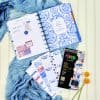 Vibrant weekly planner and decorative sticker sheets featuring blue and floral designs, perfect for organized planning and creative journaling.