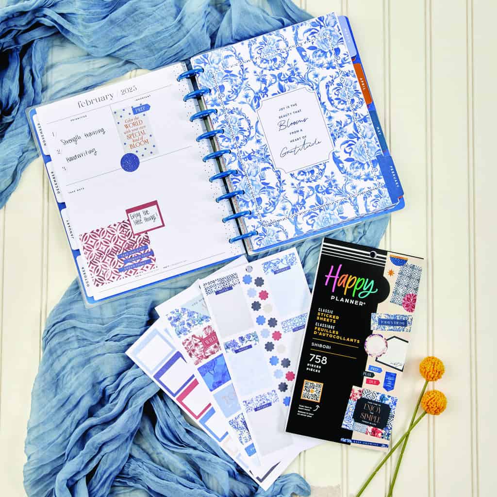 Vibrant weekly planner and decorative sticker sheets featuring blue and floral designs, perfect for organized planning and creative journaling.