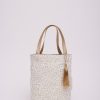 Cream and gold polka dot tote bag with tassel, stylish and versatile accessory from The Wraperie for everyday use or gifting.