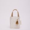 Elegant beige and gold gift tote bag with tassel, perfect for stylish gift wrapping and shopping accessories, featuring a polka dot design and durable handles.