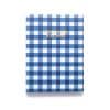 Blue checkered paper bag with “Work Hard & Be Kind” motivational quote in gold lettering, ideal for gifting or retail packaging, reflecting stylish and eco-friendly branding.