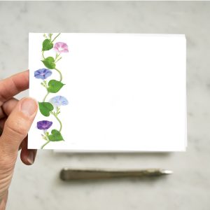 Vibrant floral border on a blank white card for personalized messages, perfect for occasions, wedding, or thank you notes. Elegant stationery with colorful morning glory flowers.