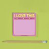 Vibrant pink "I Love This" notecard on a lime green background with a wooden pencil, perfect for personalized messages, notes, or gift tags at The Wraperie.