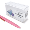 Pink retractable ballpoint pen with metallic clip and a decorative chick illustration on the packaging, ideal for gifting and writing.