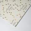 Welcome to Little One baby shower wrapping paper with gold footprints and elegant script printing. Perfect for celebrating the arrival of a new baby.