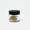 Gold paperclip storage jar with black lid, minimalist design for office or home organization, ergonomic and stylish storage solution for clips and small items in the workplace or living space, branded product from The Wraperie.